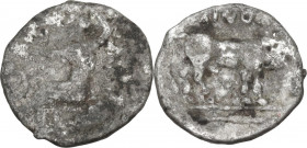 Sicily. Selinos. AR Litra, c. 417-409 BC. Obv. Nymph seated left on rock, right hand raised above her head, extending her left hand to touch coiled se...