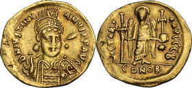 Justinian I (527-565). AV Solidus, Constantinople mint, 527-538 AD. Obv. DN IVSTINIANVS PP AVG. Helmeted and cuirassed bust facing slightly right, hol...