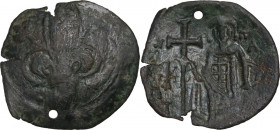 Michael VIII Palaeologus (1261-1282). Æ Trachy, Thessalonica mint. Obv. Large lis. Rev. Michael standing facing, holding long cross and akakia; lis in...