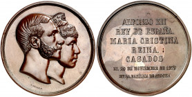 1879. Boda de Alfonso XII y María Cristina. (V. 487) (V.Q. 14400) (Ruiz Trapero 861 var. metal). Grabador: G. Sellán. Golpecitos. Rara. Bronce. 224 g....