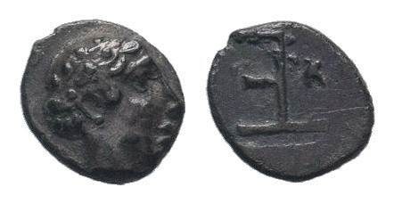IONIA.Kolophon. 525-490 BC. AR Tetartemorion. Head of Apollo right / Incuse squa...