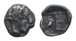 IONIA.Kolophon. 5th century BC.AR Tetartemorion.Laureate head of Apollo right / TE monogram, stork standing right, at left, all within incuse square. ...