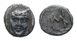 IONIA.Kolophon. 520-490 BC.AR hemiobol. Facing laureate and veiled head of Apollo, leaf at side / HM monogram, within incuse square. SNG Aulock 7898; ...
