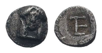 IONIA.Kolophon.Circa 490-400 BC.AR Tetartemorion. Facing head of Apollo / TE mon...