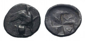 IONIA.Teos.Circa 407 BC. AR Obol. Griffin with straight wing seated right / Quadripartite incuse square; magistrate’s name engraved boustrephedon acro...