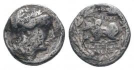 CARIA.Antiocheia on the Maeander.85-60 BC.AR 	Drachm.Laureate head of Apollo right; dotted border / ΑΝΤΙΟΧΕ above zebu bull recumbent left upon meande...