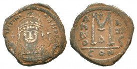 JUSTINIAN I.527-565 AD. Constantinople mint.AE Follis.DN IVSTINIANVS PP AVG, helmeted, cuirassed bust facing holding cross on globe and shield; cross ...