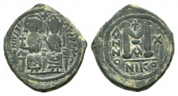 JUSTIN II and SOPHIA.565-578 AD.Nicomedia mint.AE Follis. D N IVSTINVS P P AVG, Justin II on left, Sophia on right, seated facing on double-throne, bo...