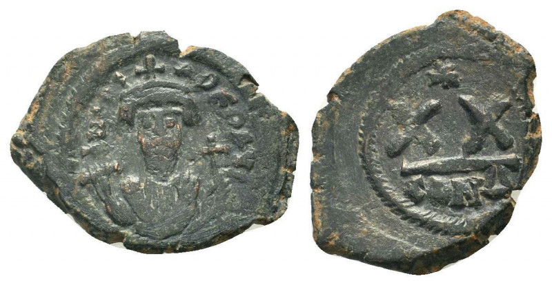 PHOCAS. 602-610 AD.Constantinople mint.AEHalf Follis.Crowned facing bust, wearin...