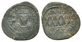 PHOCAS. 602-610 AD.Cyzicus mint.AE Follis.Crowned facing bust, wearing consular garb, holding mappa and cross; cross in left field / : Large XXXX; abo...