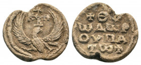 BYZANTINE LEAD SEAL.Circa 11 th- 12 th Century AD.PB Seal.Eagle, with spread wings, standing right, ebove monogram / Legend in four lines.Very fine.

...