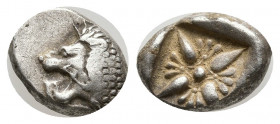 Ionia. Miletos circa 520-470 BC. Diobol AR 10mm., 1.20g. Forepart of lion to right, head turned back to left / Star-shaped floral ornament within incu...