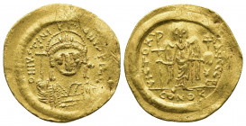 Justinian I, 527-565. Solidus (Gold, 21mm, 4.40 g), Constantinople. D N IVSTINIANVS P P AVI Helmeted and cuirassed bust of Justinian facing, holding g...