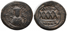 Phocas. 602-610. Æ follis (31 mm, 11.89 g). Nicomedia, RY 3 (604/5). dmFOCAS PЄR AVG, crowned bust of Focas facing, wearing consular robes, holding ma...