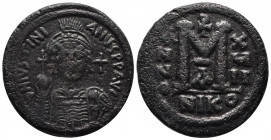 Follis, Nicomedia year 18 / 544-5, Æ33 19.67 g. D N IVSTINI – ANVS P F AVG Helmeted, diademed and cuirassed bust facing, holding globus cruciger and s...