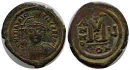 Maurice Tiberius AD 582-602. Dated RY 6=AD 587/8. Constantinople Follis Æ 27mm., 12,13g. O N MAVR TIЬЄR P P AV, helmeted and cuirassed facing bust, ho...