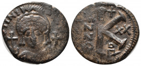 Justinian I. 527-565. Æ Half Follis (25,5mm, 8.33 g). Dated RY 20 (546/7). Helmeted and cuirassed bust facing, holding globus cruciger and shield; cro...