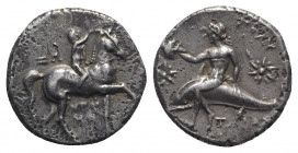 Southern Apulia, Tarentum, c. 280-272 BC. Fourreè Nomos (19mm, 6.48g, 6h). Nude youth crowning horse he rides r. R/ Phalanthos, holding helmet, riding...