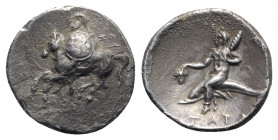 Southern Apulia, Tarentum, c. 280-272 BC. AR Nomos (20mm, 6.25g, 7h). Horseman l., holding shield and two spears; IΩ to r. R/ Phalanthos riding dolphi...