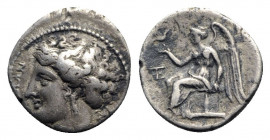 Bruttium, Terina, c. 300 BC. AR Drachm (15mm, 2.33g, 12h). Female head l., wearing triple-pendant earring; [triskeles] behind. R/ Nike seated l. on ci...