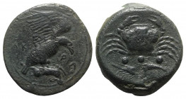 Sicily, Akragas, c. 425-406 BC. Æ Tetras – Trionkion (23mm, 10.34g, 6h). Eagle, wings raised, standing r. on, and tearing at, dead hare. R/ Crab; belo...