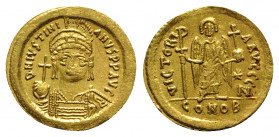 Justinian I (527-565). AV Solidus (20mm, 4.49g, 6h). Constantinople, 545-565. Helmeted and cuirassed bust facing, holding globus cruciger and shield. ...