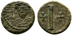 Tiberius II (578-582). Æ 10 Nummi (12mm, 3.66g). Ravenna. Helmeted and cuirassed facing bust, holding globus cruciger and shield. R/ Large I; crosses ...