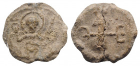 Byzantine Pb Seal, c. 7th-12th century (25mm, 8.84g, 12h). Nimbate saint standing facing, orans. R/ Cruciform monogram. VF