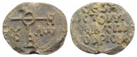 Byzantine Pb Seal, c. 7th-12th century (27mm, 10.11g). Cruciform monogram. R/ Legend in four lines. Good VF