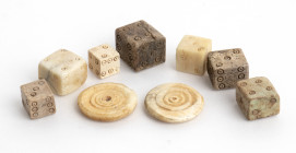 Collection of seven Roman bone dice plus two game tiles; ca. 1st - 4th centuries AD; the bigger mm 14 x 11 x 10