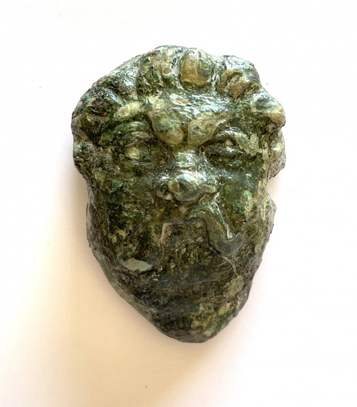 Roman bronze applique depicting a male head with mustache; ca. 1st - 3rd centuri...