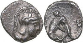 Calabria - Tarentum - AR Diobol (circa 325-280 BC)
1.06 g. 11mm. VF/VF Head of Athena right, wearing helmet decorated with Skylla./ Heracles kneeling...