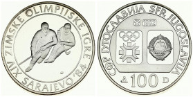 Yugoslavia 100 Dinara 1982 Ice Hockey. Averse: Emblem and Olympic logo on separate shields within flat bottom circle. Reverse: Hockey players. Edge De...
