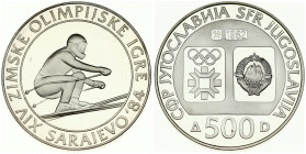 Yugoslavia 500 Dinara 1982 Downhill Skiing. Averse: Emblem and Olympic logo on separate shields within flat bottom circle. Reverse: Downhill Skier. Si...