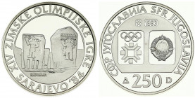 Yugoslavia 250 Dinara 1983 1984 Winter Olympics. Averse: Emblem and Olympic logo on separate shields within flat bottom circle. Reverse: Radimlja tomb...