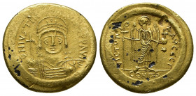 Byzantine
JUSTINIAN I (527-565). (Covering) Solidus. Constantinople.
Obv: D N IVSTINIANVS P P AVG.
Helmeted and cuirassed bust facing, holding globus ...