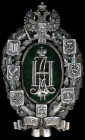 Russia, 50th Anniversary of Zemstvo, 1914, a large oval badge in oxidized silver and green enamel, by ИВ, Moscow, of multi-part construction, with mar...