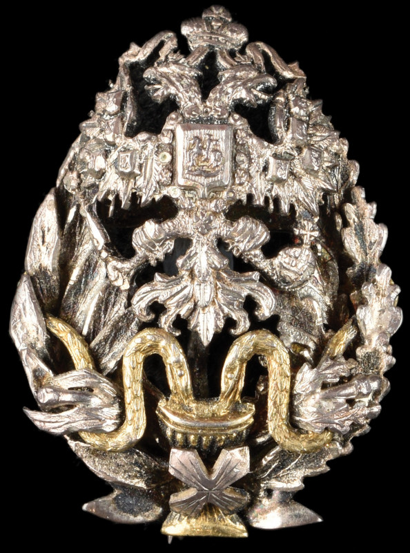 Russia, Medical Officer’s badge, of reduced size, in silver, with gilt snakes an...