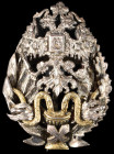 Russia, Medical Officer’s badge, of reduced size, in silver, with gilt snakes and chalice, by ИB, Moscow, width 22mm (P. & B. I, 1.1.35), mounted for ...