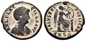 Aelia Flacilla. Follis. 383-386 AD. Thessalonica. (Ric-46). Rev.: SALVS REI PVBLICAE, Victory seated right on cuirass, drawing christogram onto shield...