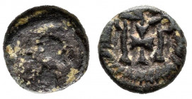 Nummus. Siglo VI. Toledo. (Cru-Grupo D, Tipo 44). Anv.: Bust on the right, in front of the cross and around the edge. Rev.: Monogram formed by two ver...