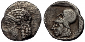 ASIA MINOR. Uncertain AR Tetartemorion , 4th century BC 
Male head (of Apollo?) to left, wearing taenia. 
Rev: Head of Athena to left, wearing Corinth...
