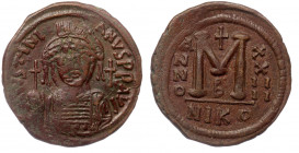 Justinian I (527-565) AE36 Follis, Nicomedia (year 24) 550-1 
D N IVSTINIANVS P F AVG - Helmeted, diademed and cuirassed bust facing, holding globus c...