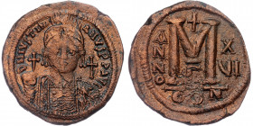 JUSTINIAN I (527-565) AE36 Follis, Constantinople, dated RY 16 (542/3). 
D N IVSTINIANVS P P AVG - Helmeted and cuirassed bust facing, holding globus ...