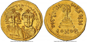 Heraclius (AD 610-641), with Heraclius Constantine. AV solidus (21mm, 4.47 gm, 7h). NGC Choice AU 4/5 - 3/5. Constantinople, 8th officina, AD 629-631....