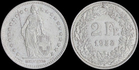 SWITZERLAND: 2 Francs (1958 B) in silver (0,835) with standing Helvetia with lance and shield within star border. Value and date within wreath. (KM 21...
