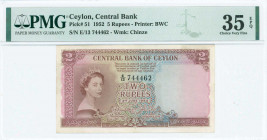 CEYLON: 5 Rupees (3.6.1952) in purple on blue, green and orange unpt with portrait of Queen Elizabeth II at left. S/N: "E/13 744462". WMK: Chinze. Pri...