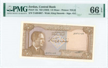 JORDAN: 1/2 Dinar (ND 1959) in brown on multicolor unpt with King Hussein at left. S/N: "TA 894087". WMK: King Hussein wearing kuffiyeh". Printed by T...