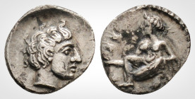 Greek
CILICIA. Tarsos. (Circa 389-375 BC )
AR obol (9.6 mm, 0.62 g.) 
Young woman kneeling left, casting astragaloi./ Head of young man right within i...