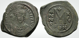 Byzantine
Maurice Tiberius ( 582–602AD) Constantinople 
AE Follis ( 34.6mm 12.5g.)
Obv: Helmeted and cuirassed facing bust, holding globus cruciger an...
